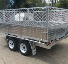 Custom flat top trailer with cage enclosure