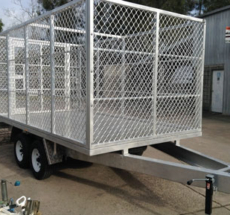 Custom flat top trailer with cage enclosure