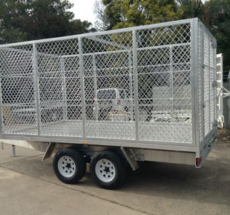 Custom flat top trailer with cage enclosure